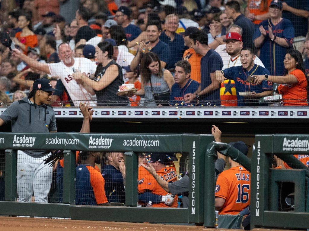 The Astros dugout went crazy after Yordan Alvarez's third home run. (Photo by F. Carter Smith)