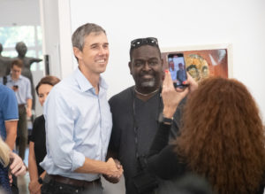 Beto O’Rourke taking photo with attendee