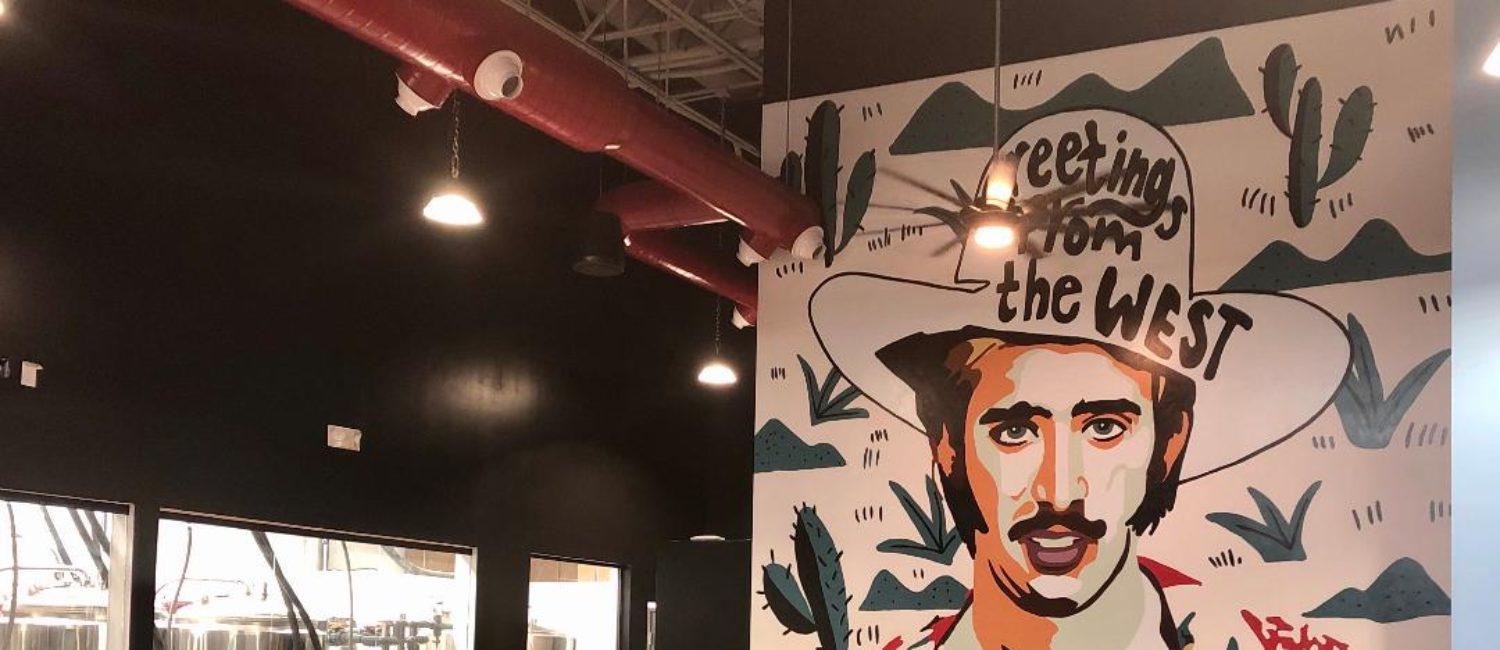 Boozie’s – Will roll with the kitschy Nicolas Cage Mural on its back wall. Photo by Courtney Dabney.
