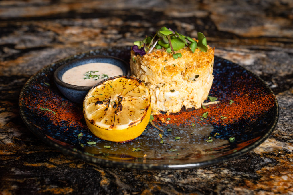 Luis Rangel, owner of Gatsby's Prime Steakhouse, is expanding his repertoire into seafood with the opening of Gatsby's Prime Seafood. Pictured here their version of crab cakes. (Photo by Michael Anthony)