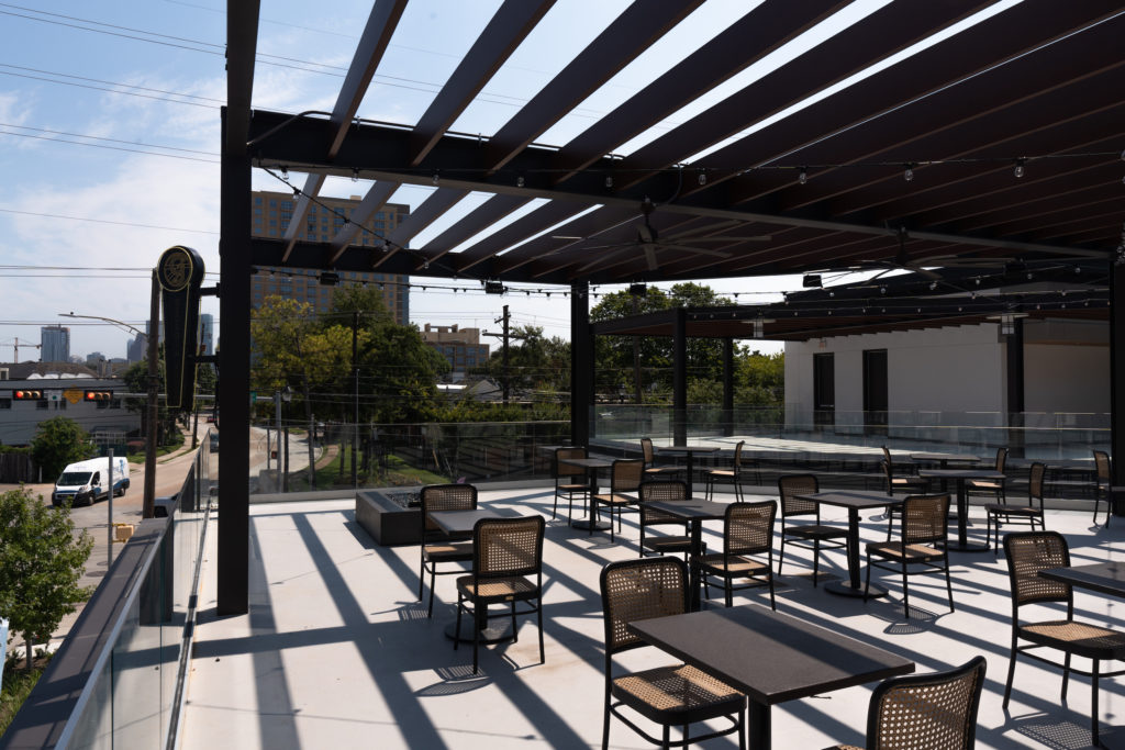 Outside, the new Rooftop Lounge at Georgia James features two terraces with soft seating and fire pits.  (Photo by Michael Anthony)