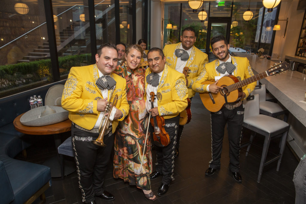 Sarah Evenson with the mariachi band that performed. (Photo by Jenny Antill)