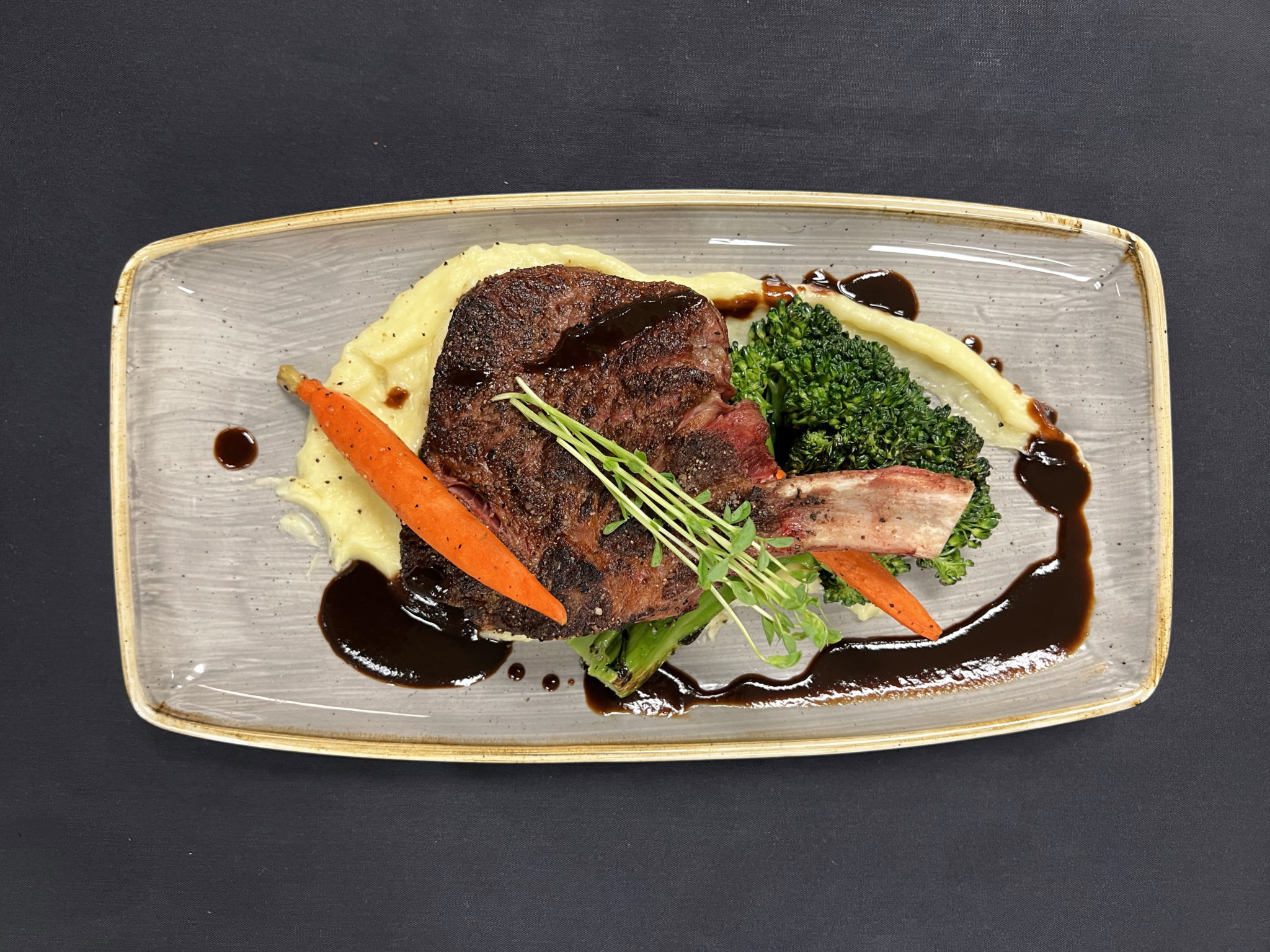 Lone Star BoneIn Ribeye with Roasted Garlic Potato Puree & Charred