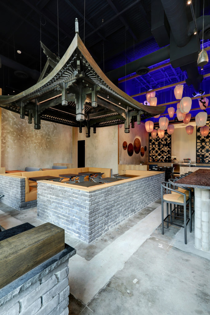 Gin Design Group created a full-size wooden Pagoda roof, handmade by Sichuan artisans. Put together solely with wooden joinery it floats above the dining room. (Photo by Bill Krampitz)