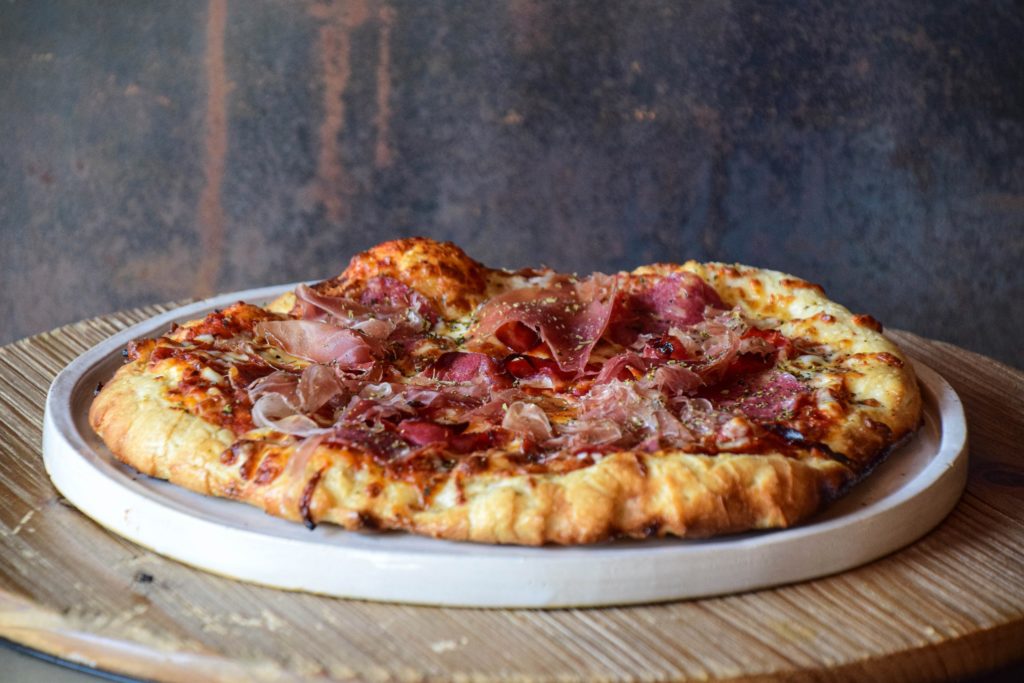 The Back Room will serve wood fired pizza with prohibition cocktails and draft beer.