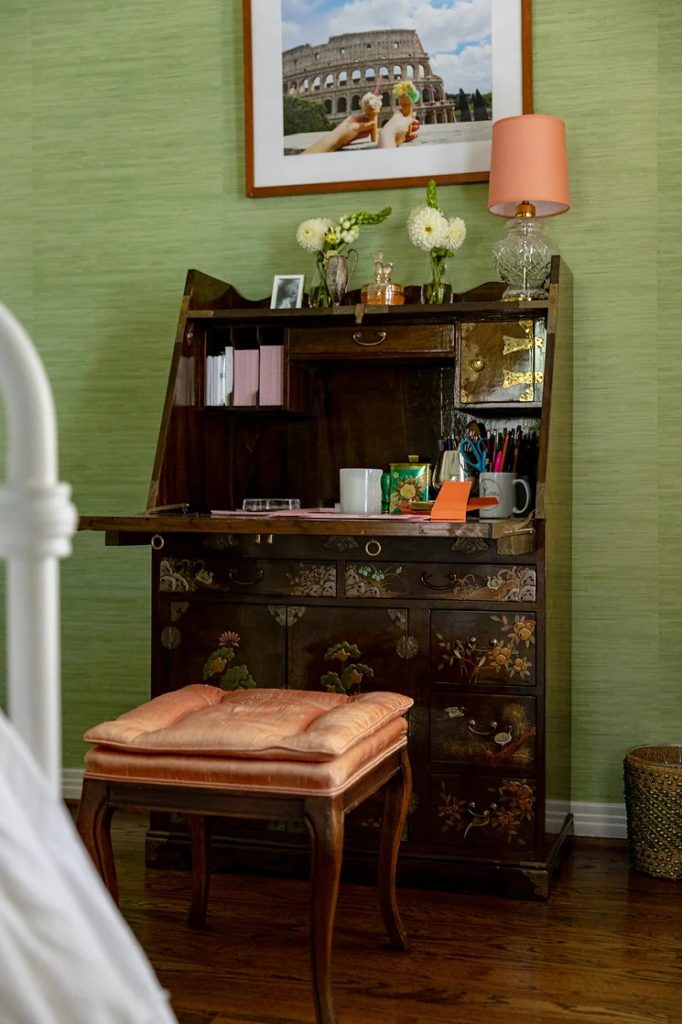 A thrifted coral silk ottoman and chinoiserie secrétaire decorate the second bedroom. 
