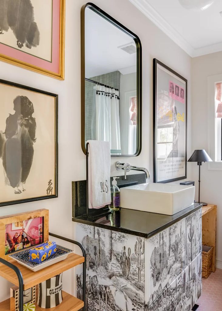 A Pierre Frey print surrounds the second bathroom sink. 