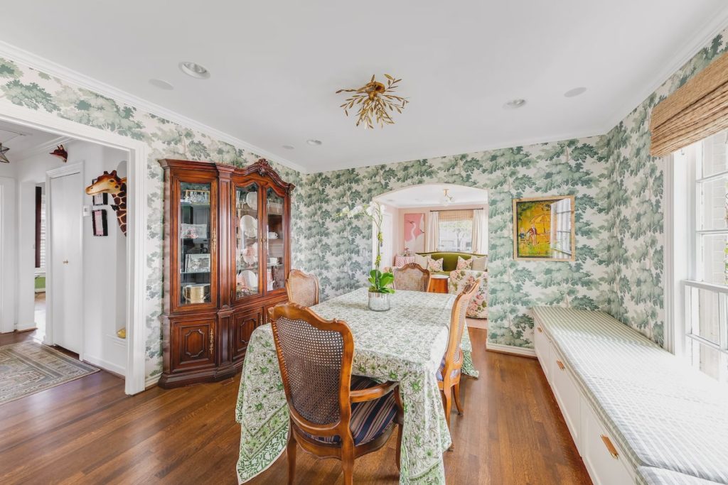 Animal heads peep out from hallway alcoves. 