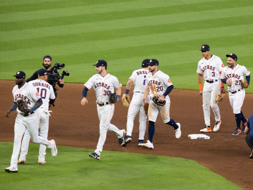 The Houston Astros celebrated as one after yet another win over the Yankees in an American League Championship Series game. (Photo by F. Carter Smith)