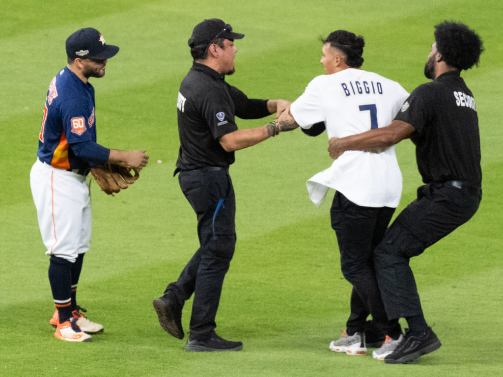 The selfie-seeking fan who ran onto the field didn't seem to faze Astros star Jose Altuve in the least. (Photo by F. Carter Smith)