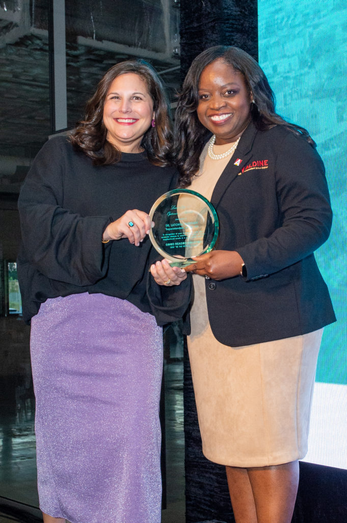 Alex Elizondo, award recipient Dr. LaTonya Goffney at Good Reason Houston's 'Be the Reason' cocktail fundraiser. 