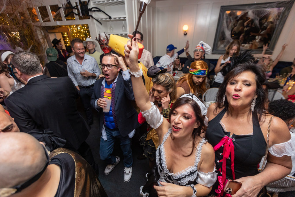 The Astros win at the Halloween party crowd at Brasserie 19 cheer. (Photo by Andrew Hemingway)