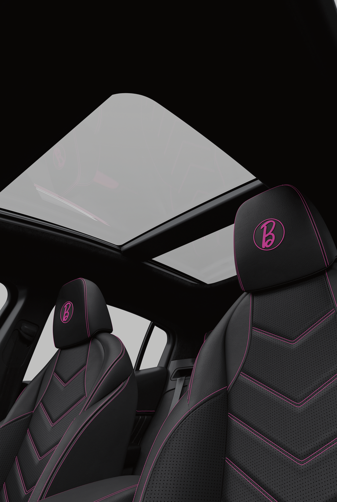 The doors are detailed with pink stitching, and the headrests are branded with a signature "B" badge. (Courtesy Maserati)