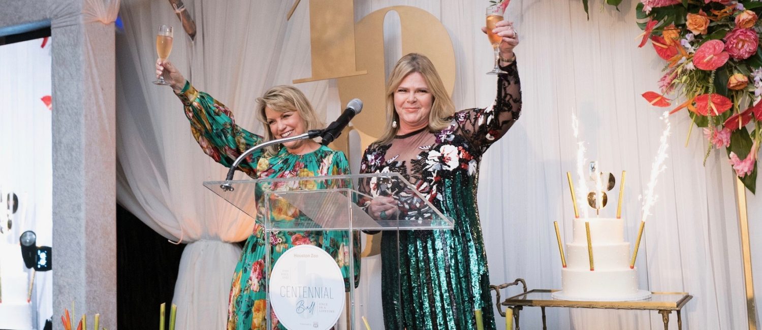 Houston Zoo Centennial gala chairs Kelley Lubanko and Kelli Weinzierl make a champagne toast as part of the celebration. (Photo by Daniel Ortiz)