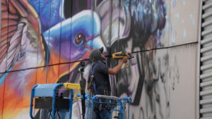 In-process mural ” Hoping for a Greener Future” (Photo by @superkant and @cyvisuals_, courtesy Street Art for Mankind)