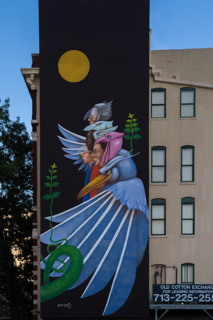 Ana Marietta's completed mural, "Sharing the World" (Photo by @superkant and @cyvisuals_, courtesy Street Art for Mankind)