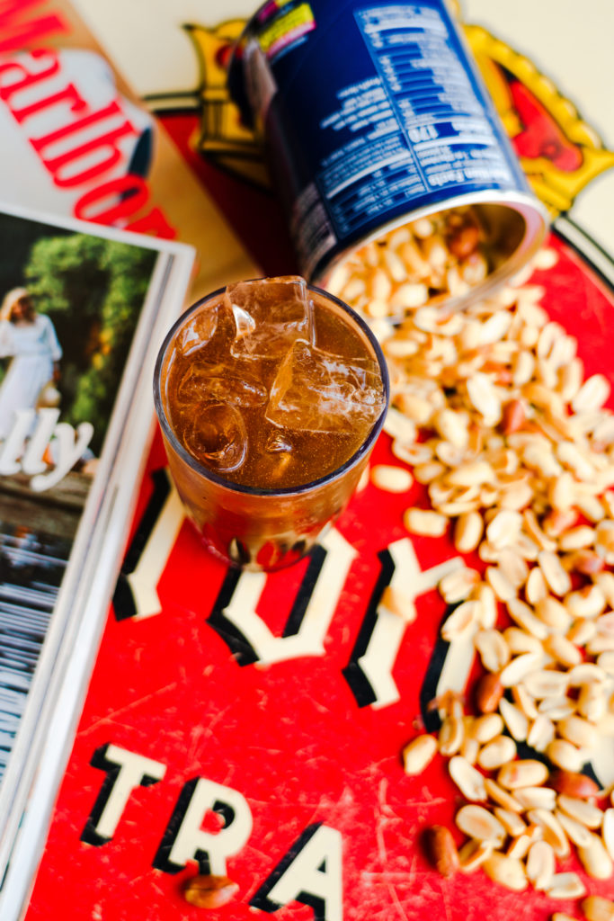 EZ's Liquor Lounge features an array of drinks including this riff on the highball called the Hillbilly Highball. It's made with peanut butter bourbon, Mexican coke and peanuts. (Photo by Mikah Danae)