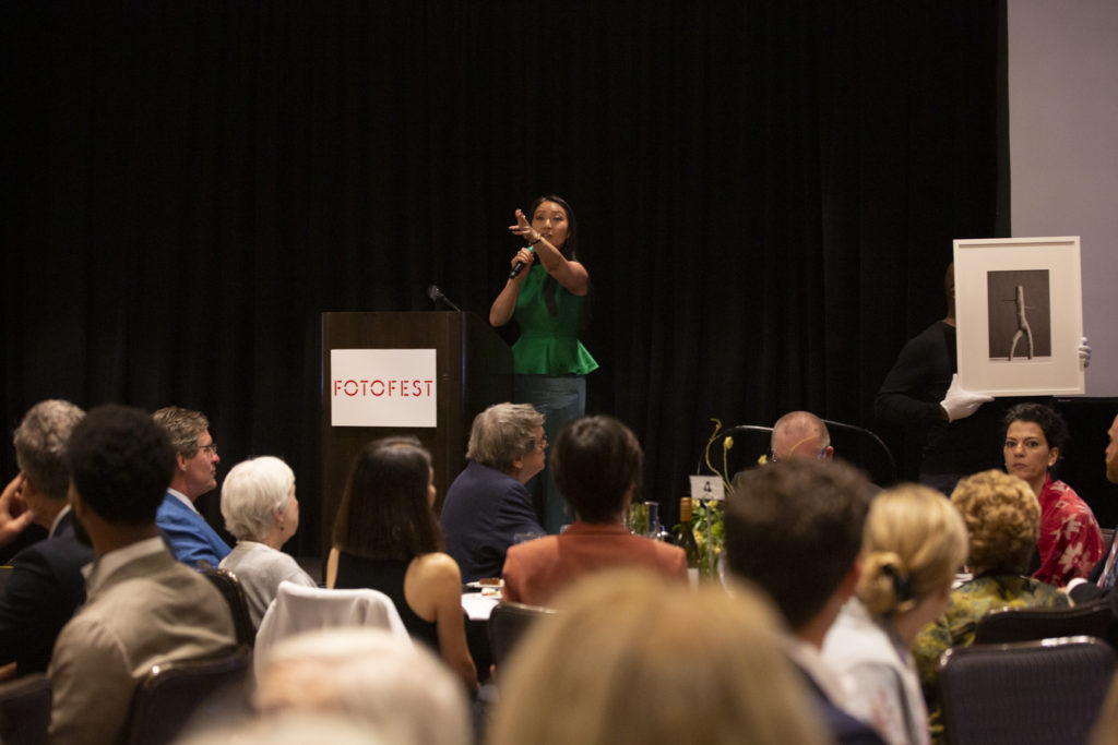 Auctioneer Phyllis Kao of Bonhams hammered down lots at the FotoFest Fine Print Auction. (Photo by Tere Garcia)