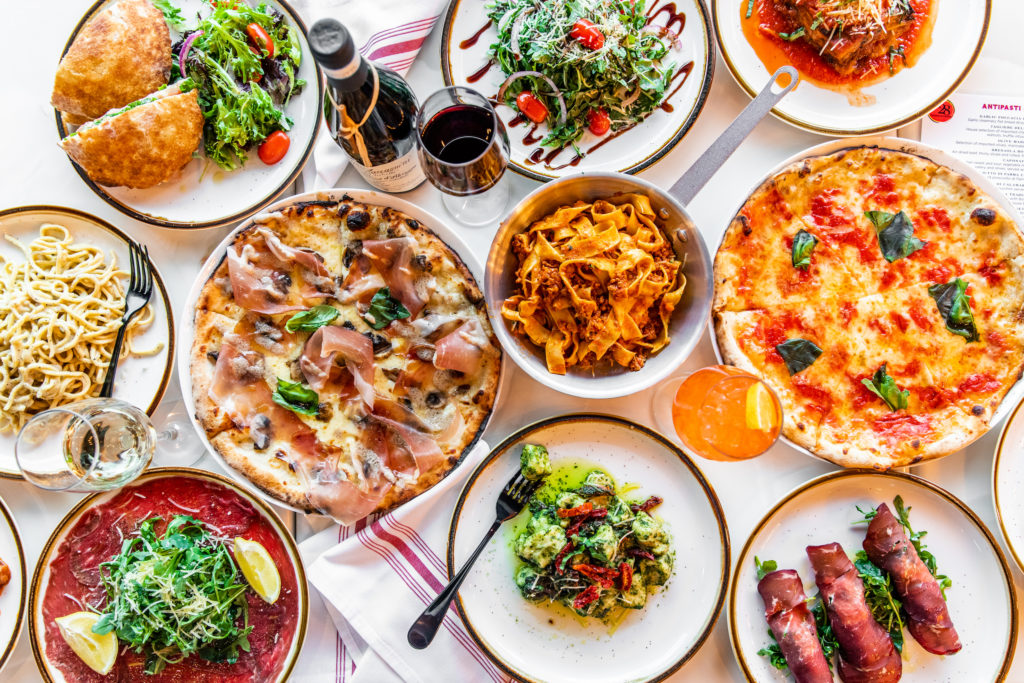 An array of the pizzas, pasta and antipasto served at the new Southern Italian eatery. (Photo by Becca Wright)