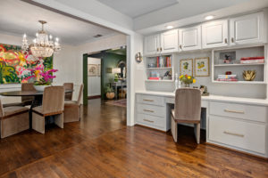 104 Crestwood – Clean kitchen office flows to the formal dining room with its French Empire chandelier.