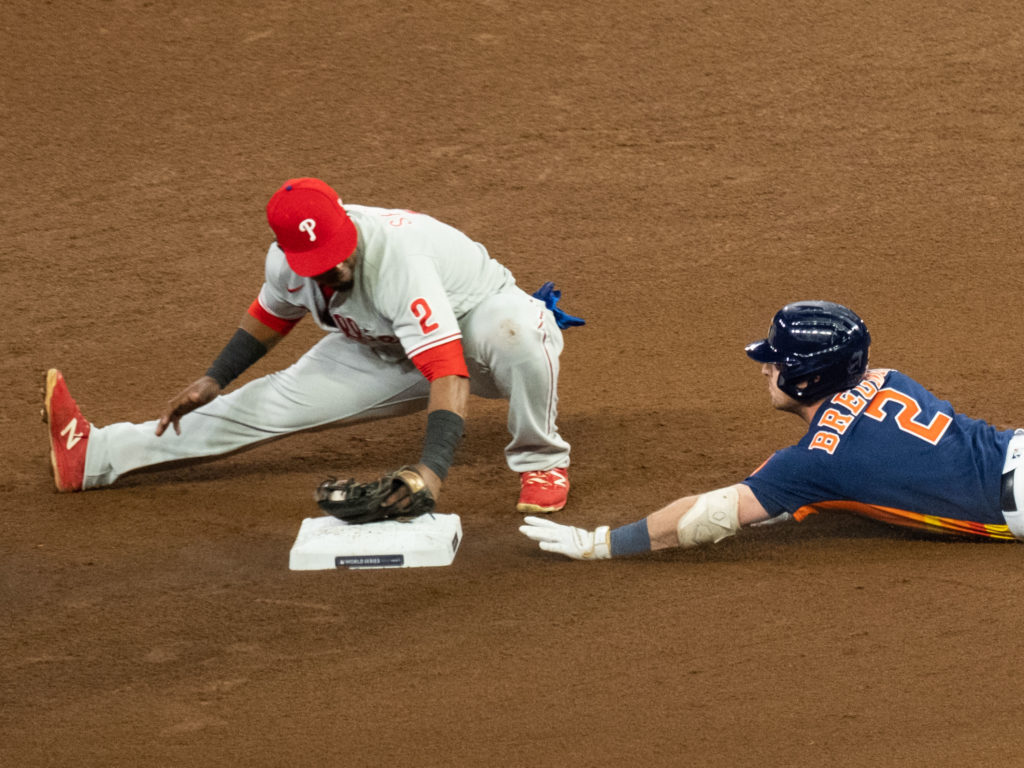 Astros third baseman Alex Bregman broke a finger on his hand during this slide, but he never thought of leaving the game. Even when he felt like throwing up. (Photo by F. Carter Smith)