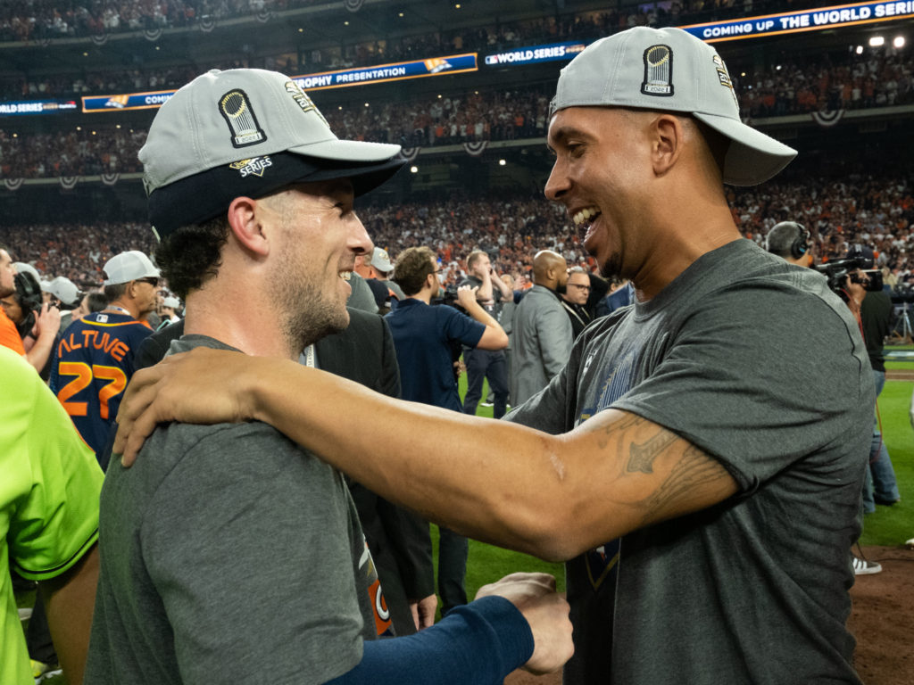 Alex Bregman and injured Astros vet Michael Brantley shared a moment. Brantley didn’t play a minute in these playoffs, but he still helped turn around the Astros season with his speech in Philadelphia. (Photo by F. Carter Smith)