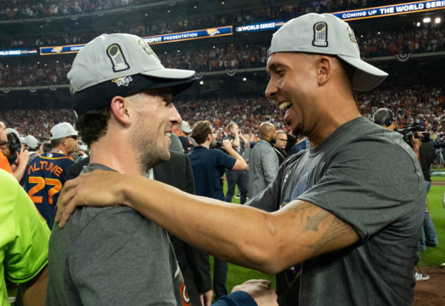 Alex Bregman and injured Astros vet Michael Brantley shared a moment. Brantley didn't play a minute in these playoffs, but he still helped turn around the Astros season with his speech in Philadelphia. (Photo by F. Carter Smith)