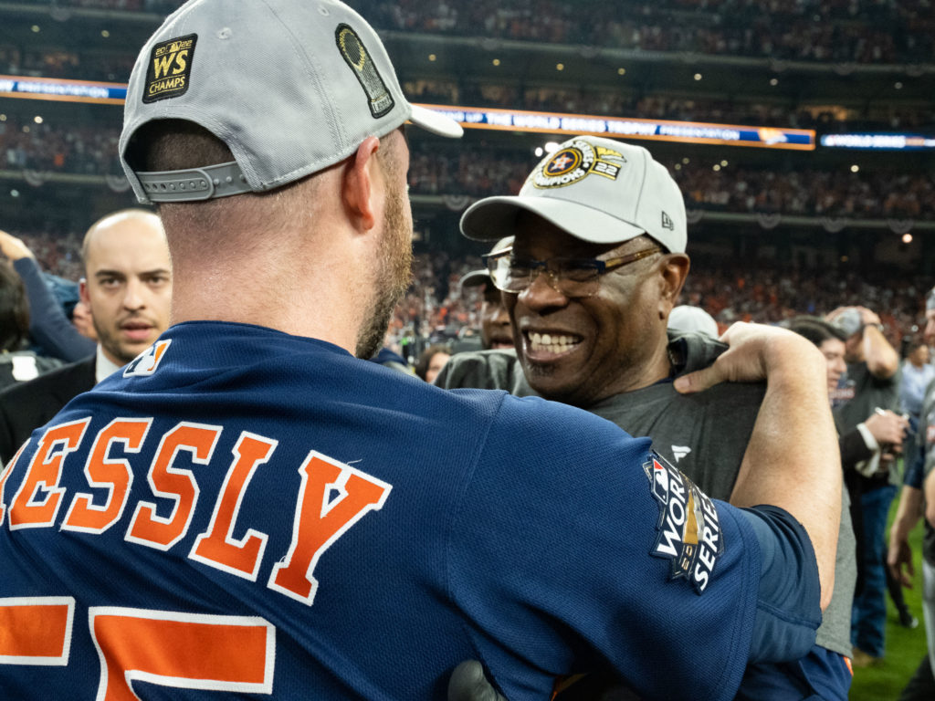Astros closer Ryan Pressly couldn't wait to hug Dusty Baker. Everyone wanted to hug Baker, a baseball lifer who is a world champion at last. (Photo by F. Carter Smith)