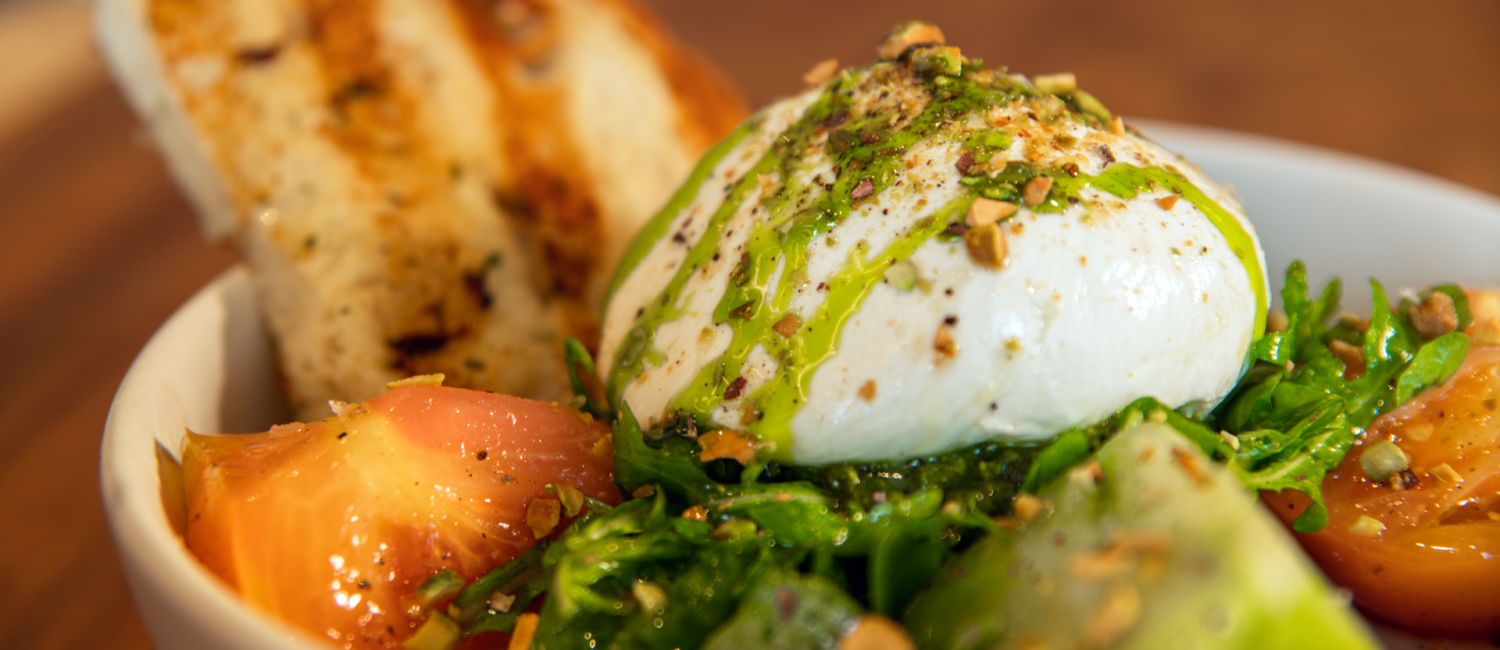Burrata Caprese served with pesto and heirloom tomatoes is one of the dishes at the new Woodlands Burrata Caprese. (Photo Courtesy of Zanti Cucina Italiana) (Photo by Courtesy of Zanti Cucina Italiana)