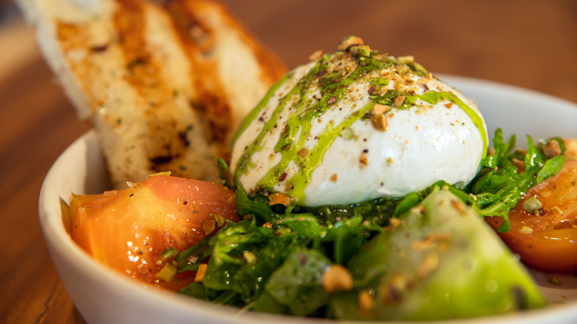 Burrata Caprese served with pesto and heirloom tomatoes is one of the dishes at the new Woodlands Burrata Caprese. (Photo Courtesy of Zanti Cucina Italiana) (Photo by Courtesy of Zanti Cucina Italiana)