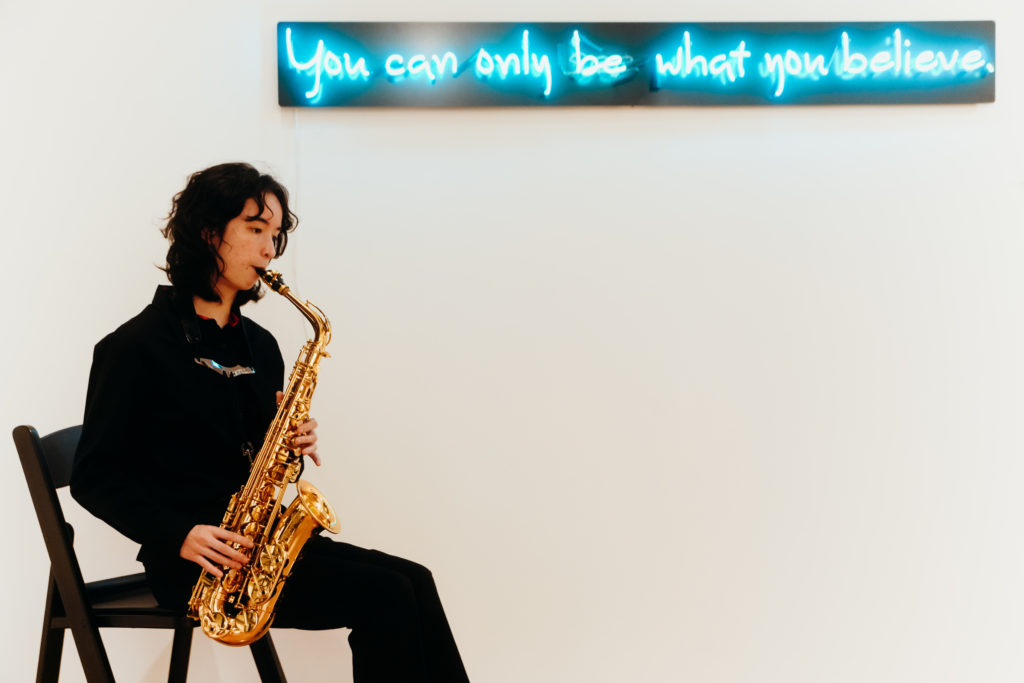 A student saxophonist from HSPVA provided chill tunes at CoolXDad X Color Box at ELLIO Fine Art. (Photo by William Issac)