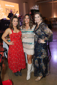 Emcee Jenny Anchondo with co-chairs Ashley White and Shannon Hanberry (Photo by Nate Rehlander)