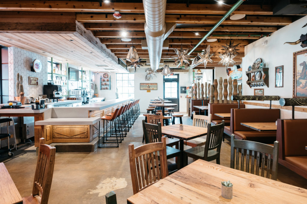 Kitchen & Cantina's interiors say, “Bienvenidos, y’all!” (as does a literal sign at the entrance) with its casual, welcoming space which is perfect for gathering with family and friends. (Photo by Caroline Fontenot)