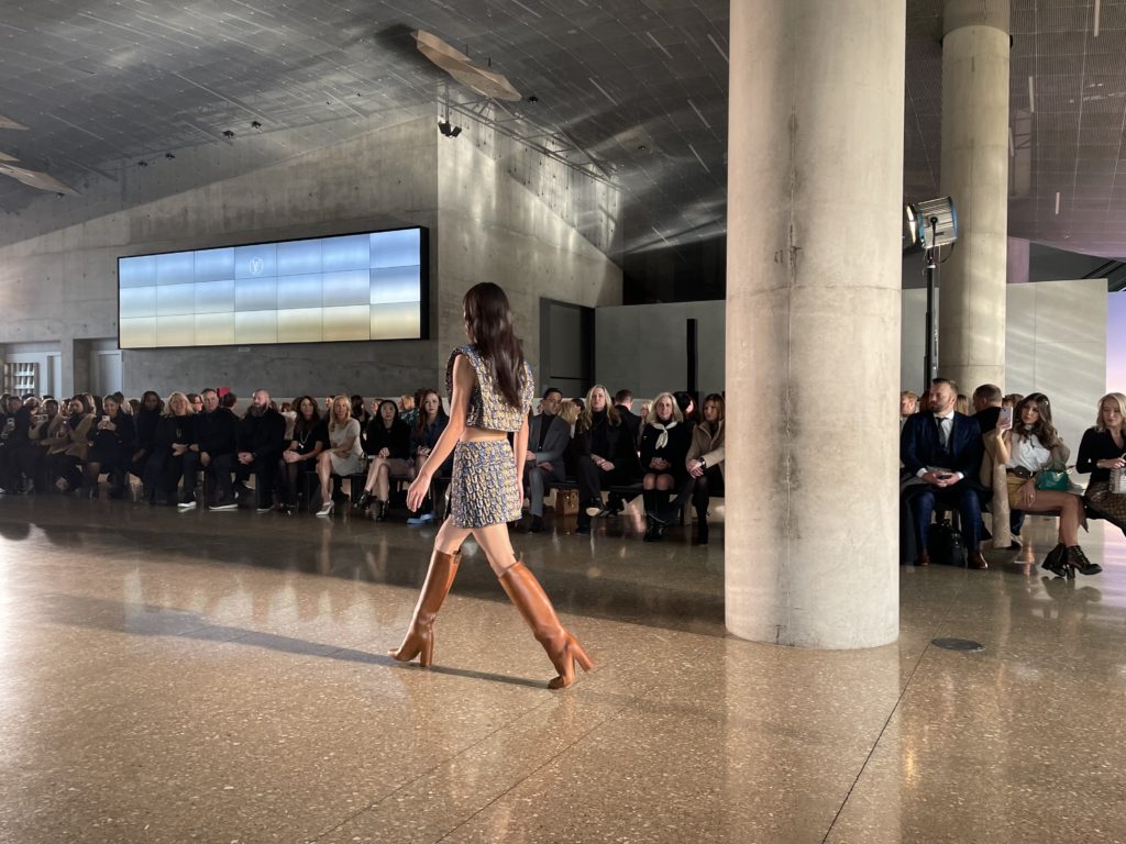 Invited guests take in the Louis Vuitton show. Photo by Courtney Dabney.