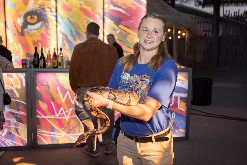Julie B. with boa constrictor (Photo by Thomas Garza and Rob Wythe/Wythe Portrait Studio)