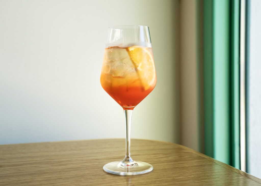 Cheers! Toast to the new opening in EaDo of Louie's Italian American with their classic cocktail, the Aperol Spritz. Photos by Lindsey Cooper-Trevino and Sergio Trevino. (Photo by  Photography courtesy of Lindsey Cooper-Trevino and Sergio Trevino )