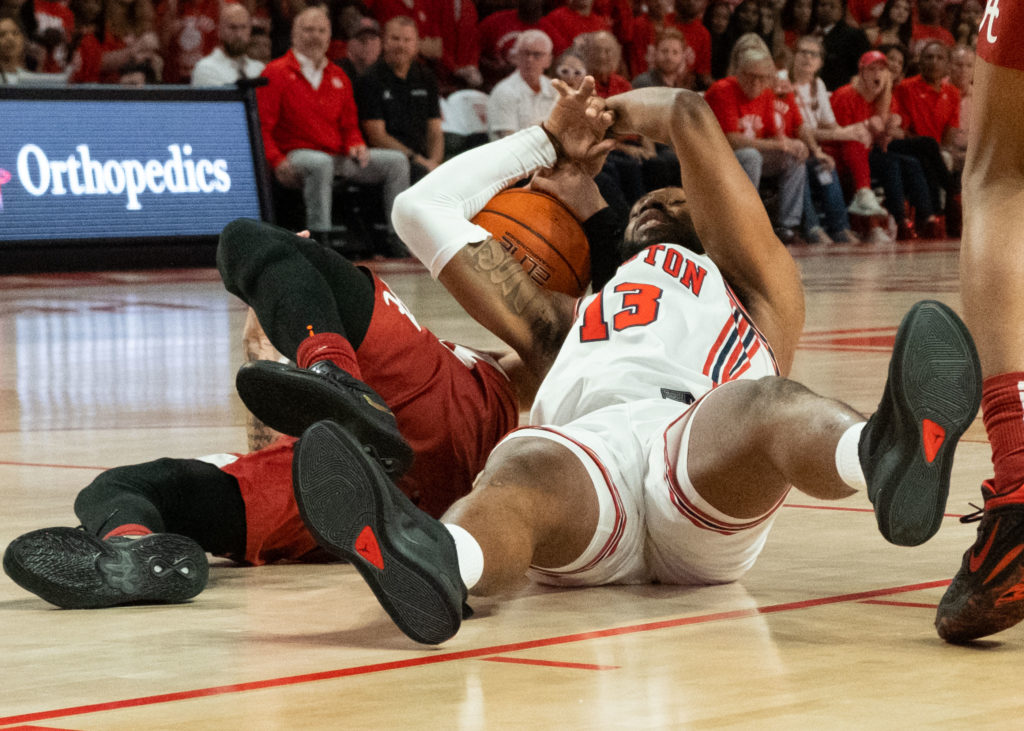 University of Houston forward J'Wan Roberts knows that sometimes you have to go to the floor to get the basketball. (Photo by F. Carter Smith)