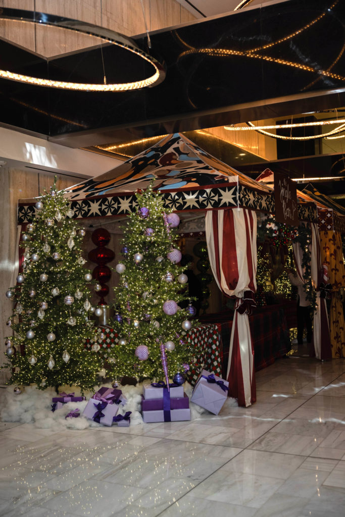 Thompson Dallas Holiday Market featuring live holiday jazz and a variety of elaborate food and beverage activations in the lobby.