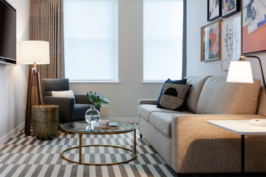 The king suite at Kimpton Harper boasts handmade furniture and work by local artists.