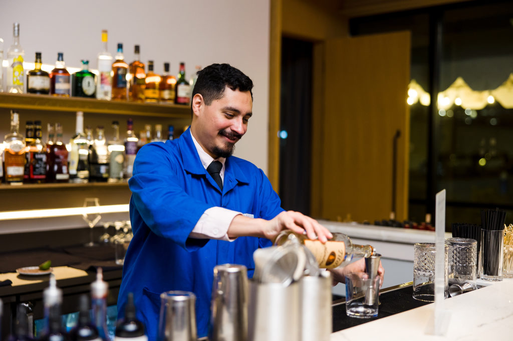 A Navy Blue bartender at the Texas Children's Hospital Ambassadors Holiday Party held at Navy Blue in Rice Village (Photo by Jenny Antill Photography) 