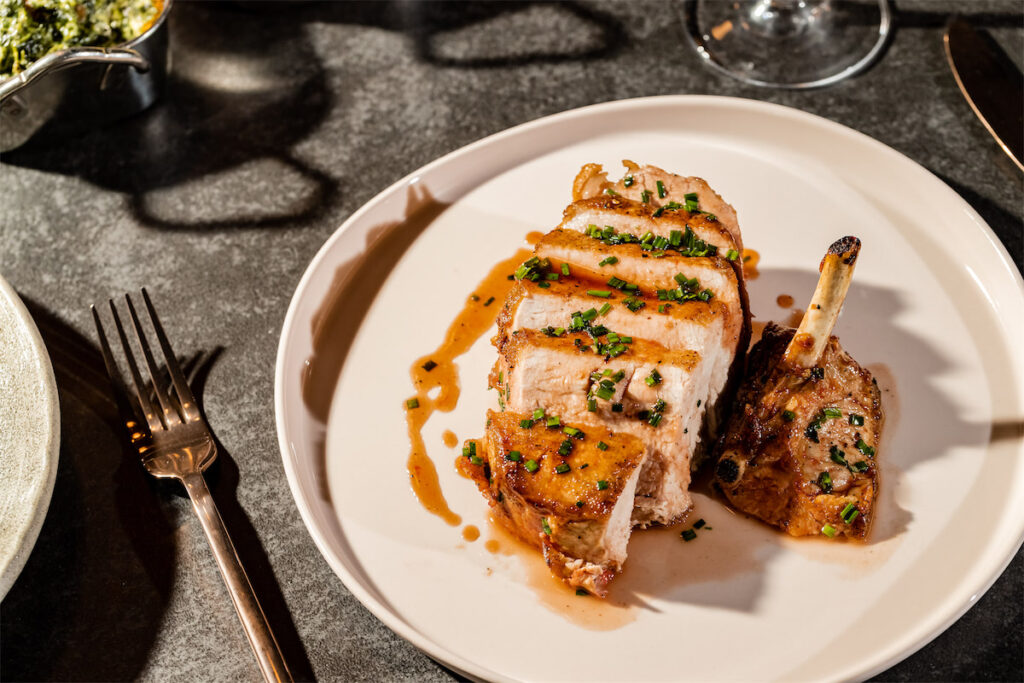 The Negroni Glazed Duroc Pork Chop is another highlight at The Saint. (Photo by Kayla Enright)