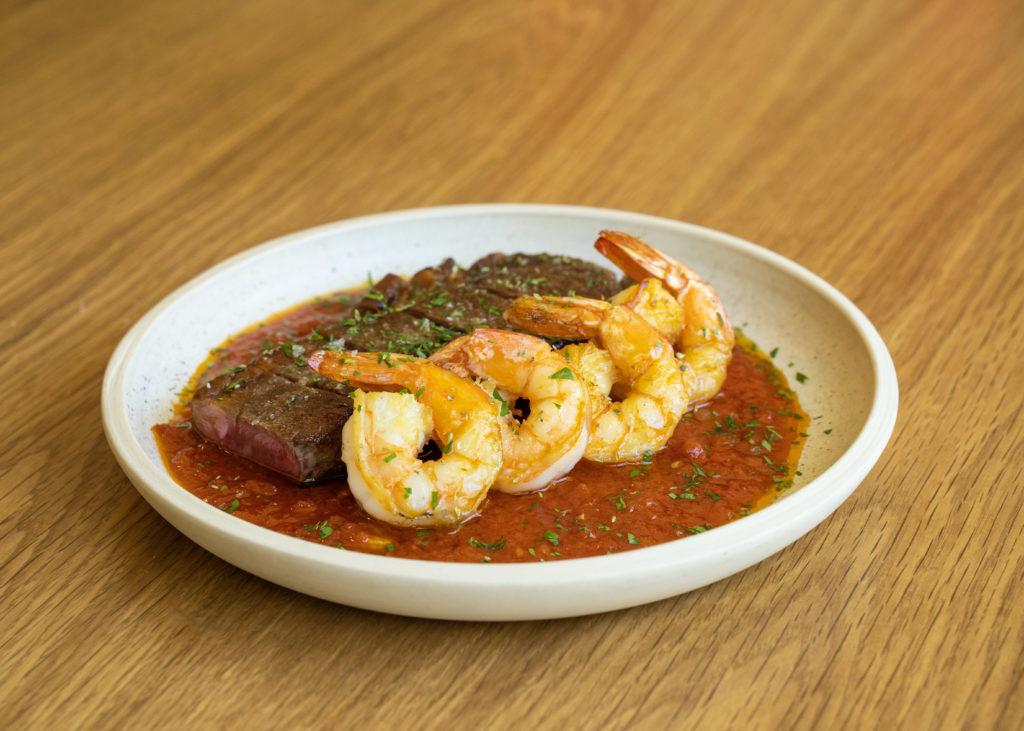 Steak and Shrimp Fra Diavolo made with wagyu New York strip steak and Gulf Coast shrimp is on Louie's Italian American menu. Photo by Lindsey Cooper-Trevino and Sergio Trevino.