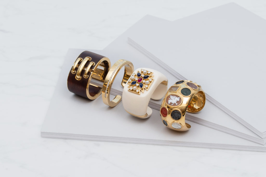 David Webb shoelace cuff bracelet, available in ebony and bloodwood; Italian 18K gold cuff with diamonds; mid-century Verdura Maltese cross cuff bracelet set with sapphires, rubies, diamonds and pearls, circa 1950; Seaman Schepps Intaglio Cuff set with hardstone and shell intaglios and cameos