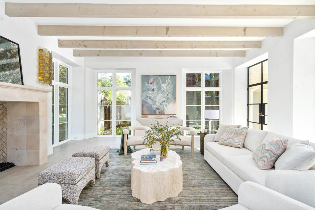 The main salon at 2445 Pine Valley Court with its 60" X 60" stone fireplace. (Photo by Sonya Bertolino)