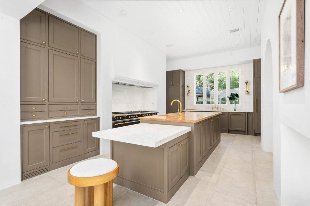 Close up of the kitchen with its magnificent oven, butcher block island with marble counter for baking. (Photo by Sonya Bertolino)