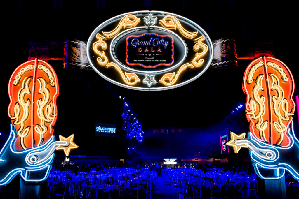 Neon signs flank the entrance to the Junior League of Fort Worth Grand Entry Gala. Photo by Canon Elizabeth Photography
