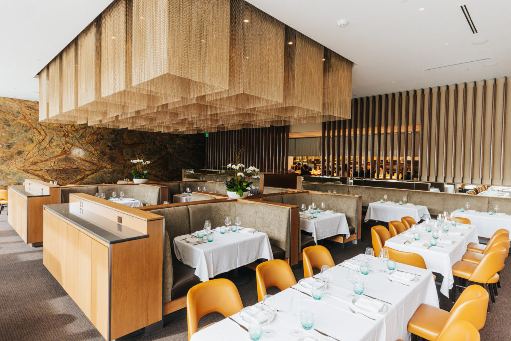  Ibanez Shaw Architects designed the new restaurant complete with central banquette seating, topped by the focal aluminum fabric lighting. Photo by Kathy Tran.