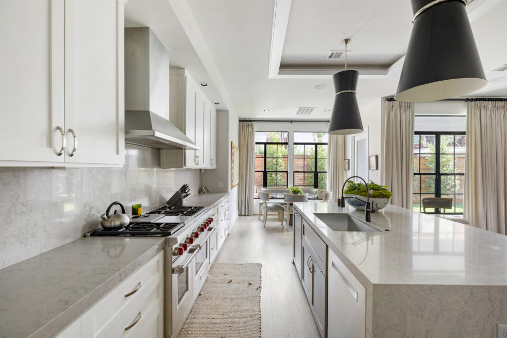 The kitchen at 1919 Elmen in Houston features Restoration Hardware fixtures and Wolf and Subzero appliances. (Photo by JG Photography)