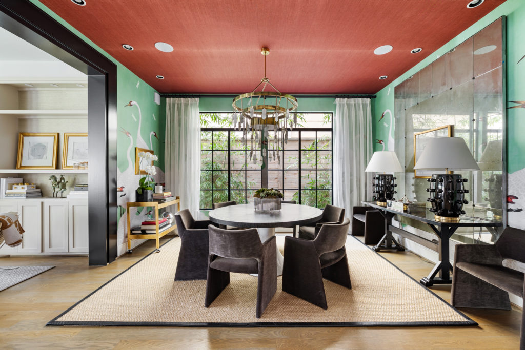 The formal dining room at 1919 Elmen is covered in swan wallpaper by Gucci. (Photo by JG Photography)
