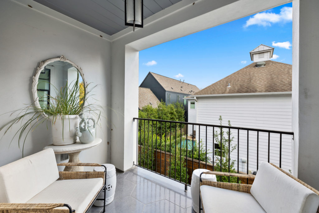 The primary bedroom at 1919 Elmen St. in Houston has a second floor balcony. (Photo by JG Photography)